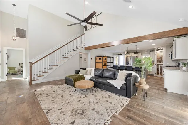 a living room with fireplace furniture and a flat screen tv