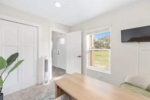 a view of a swimming pool with an outdoor space and seating area