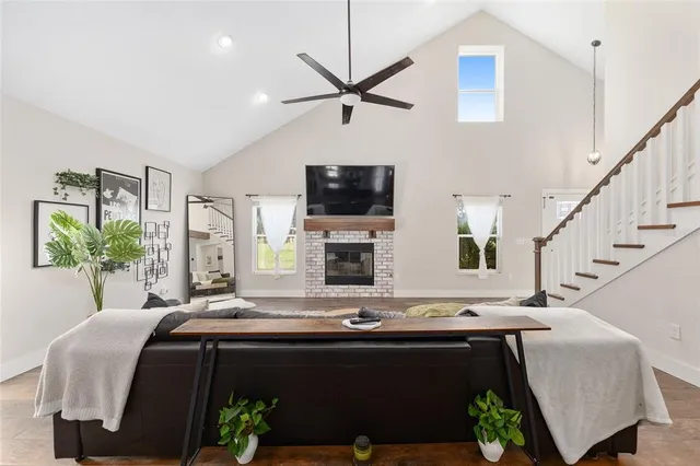 a bathroom with a granite countertop sink a toilet and a mirror