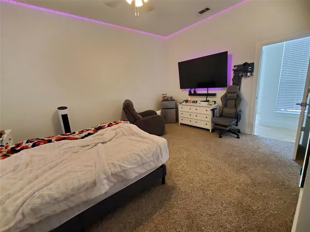 a bedroom with bed and a window