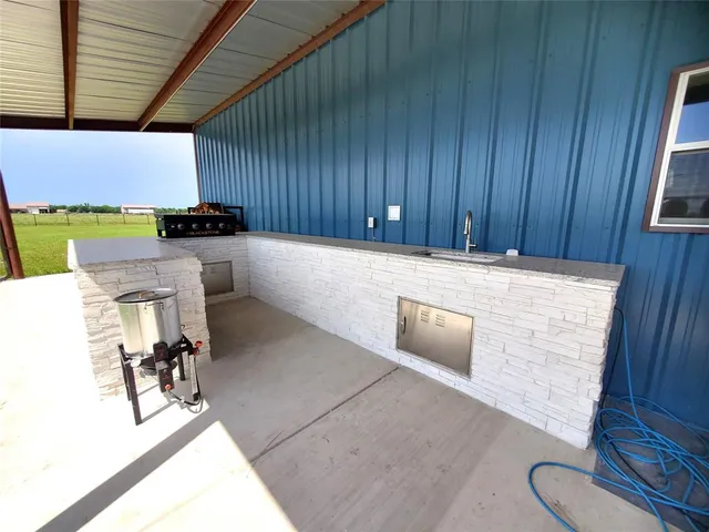 a view of living room and kitchen with furniture