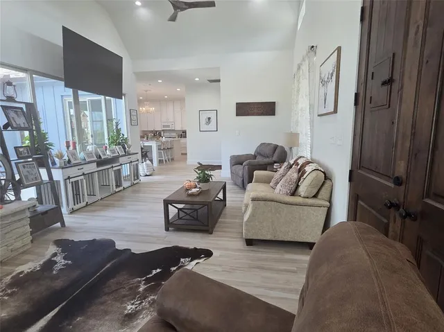 a living room with furniture and a table