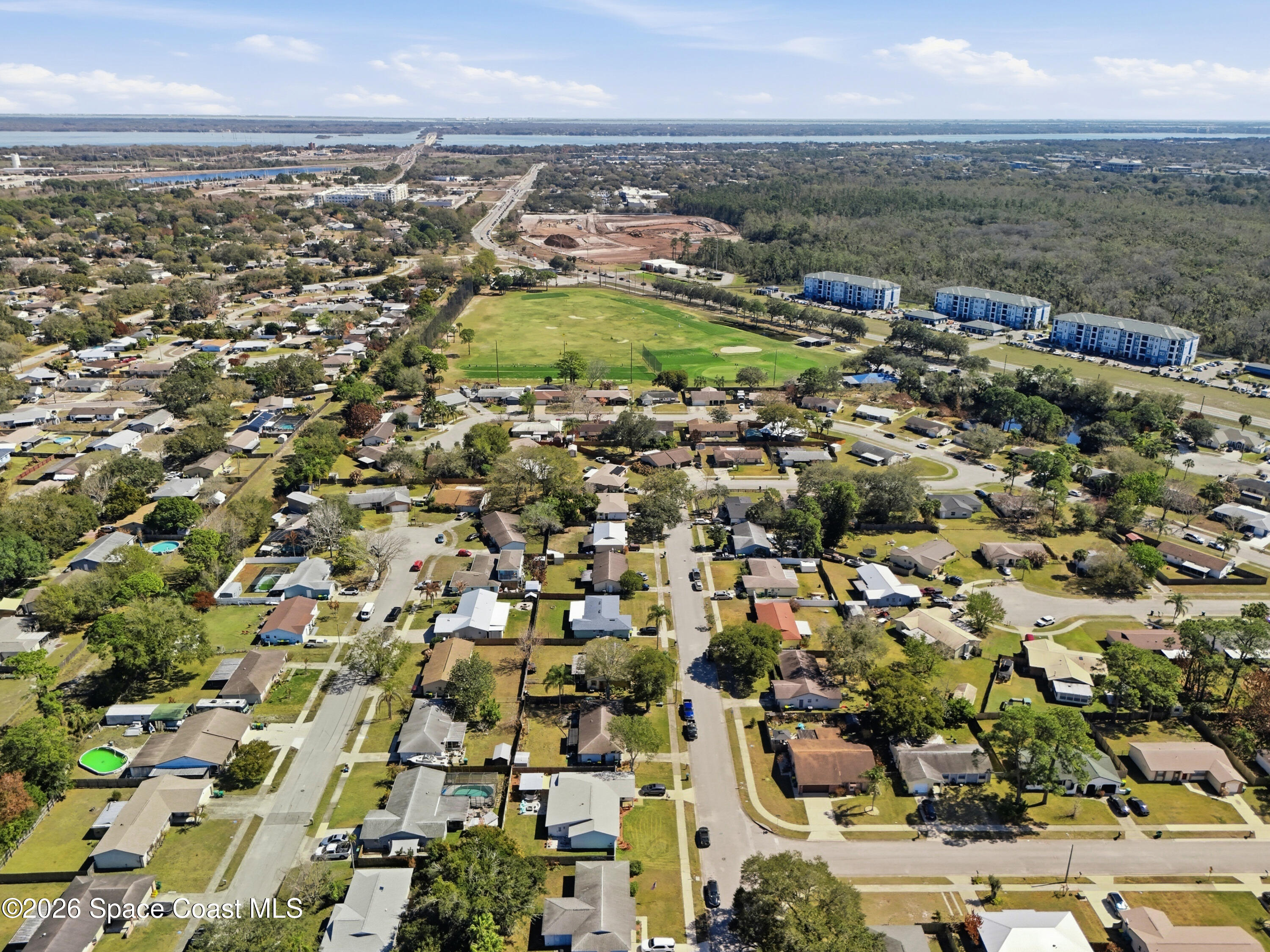 3660 Longbow Road Cocoa, FL 32926 - Photo 11 of 13 an aerial view of residential building with parking space