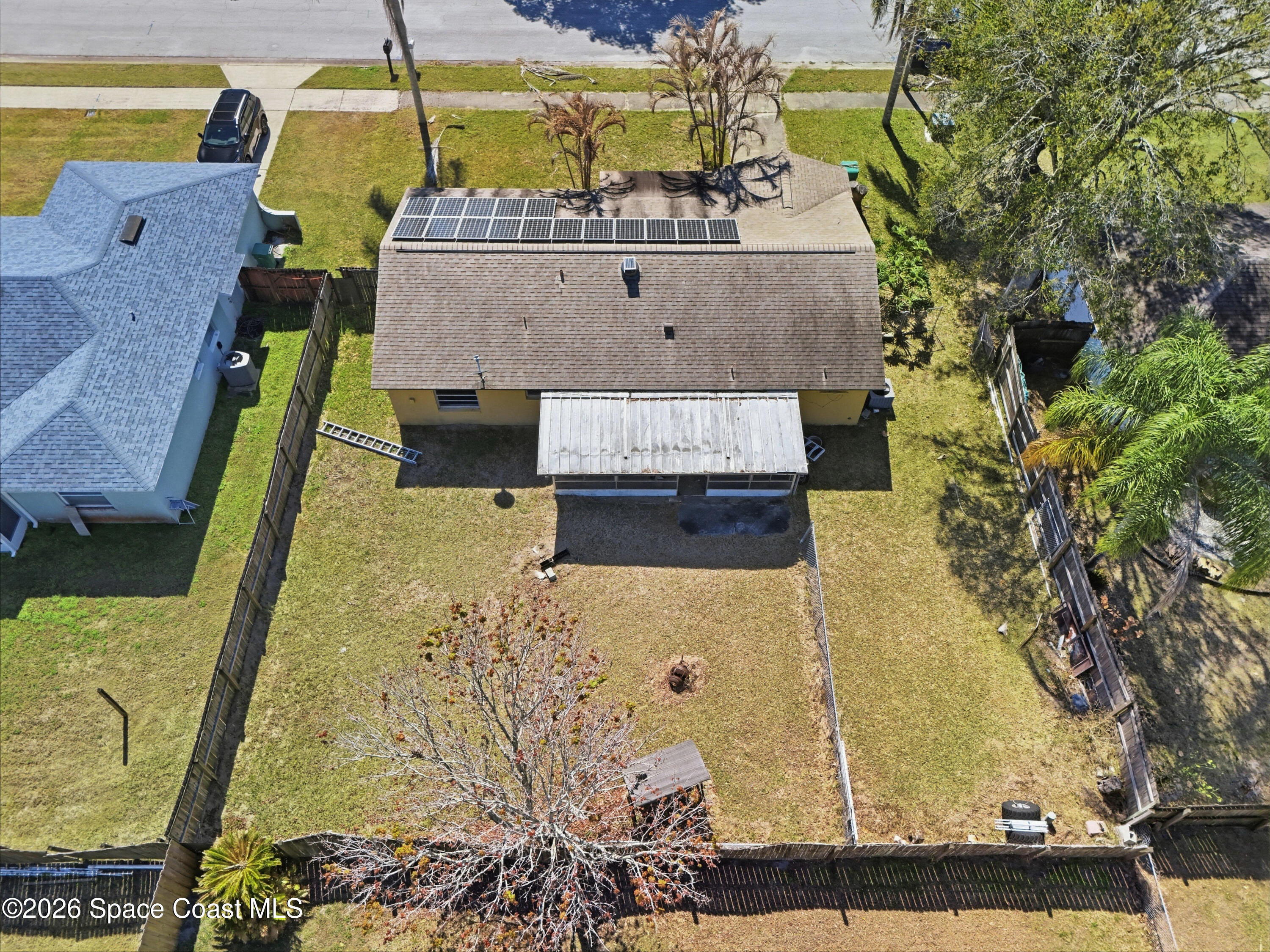 3660 Longbow Road Cocoa, FL 32926 - Photo 3 of 13 an aerial view of a house with a swimming pool