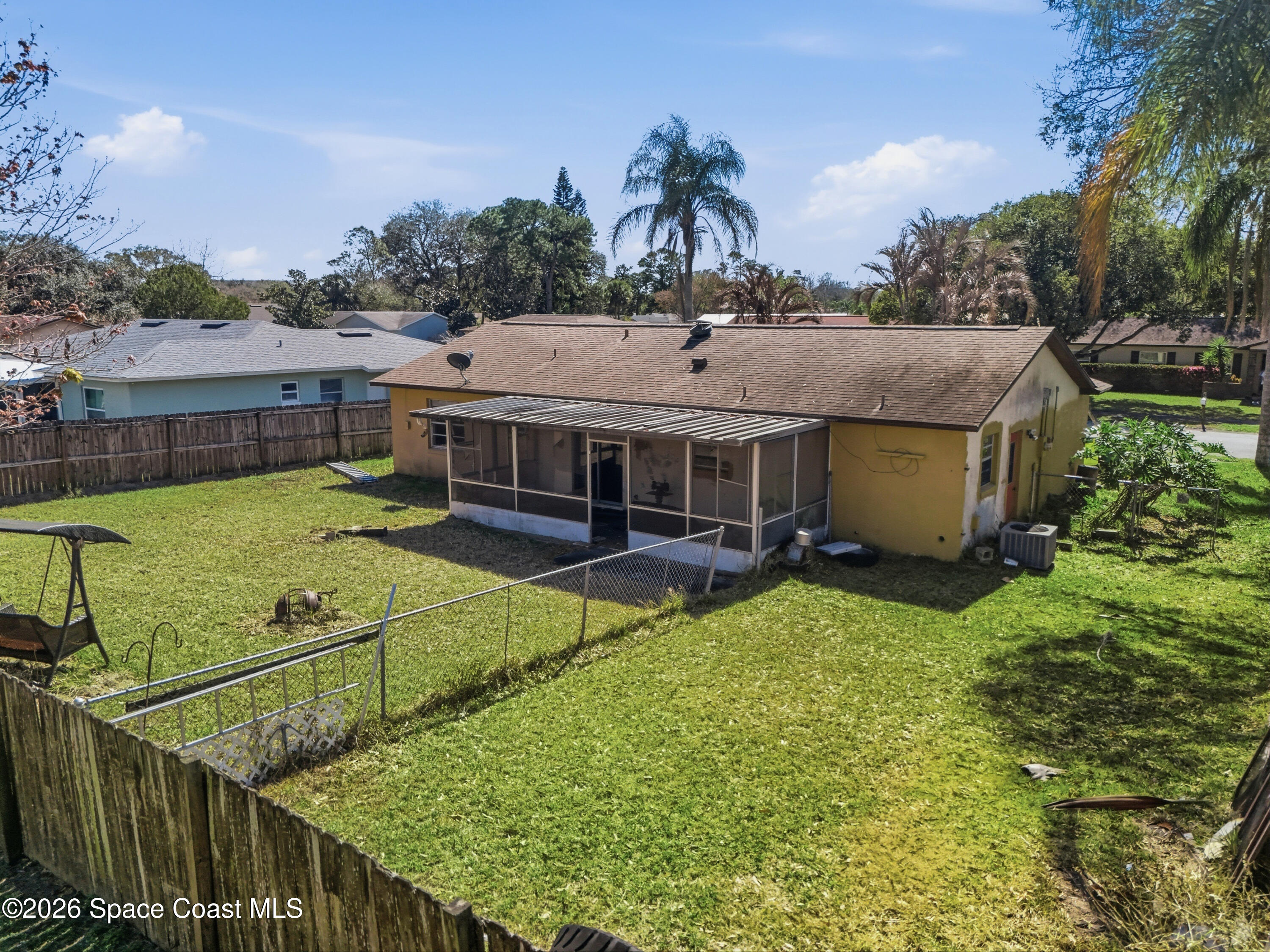 3660 Longbow Road Cocoa, FL 32926 - Photo 4 of 13 a view of a house with backyard and sitting area