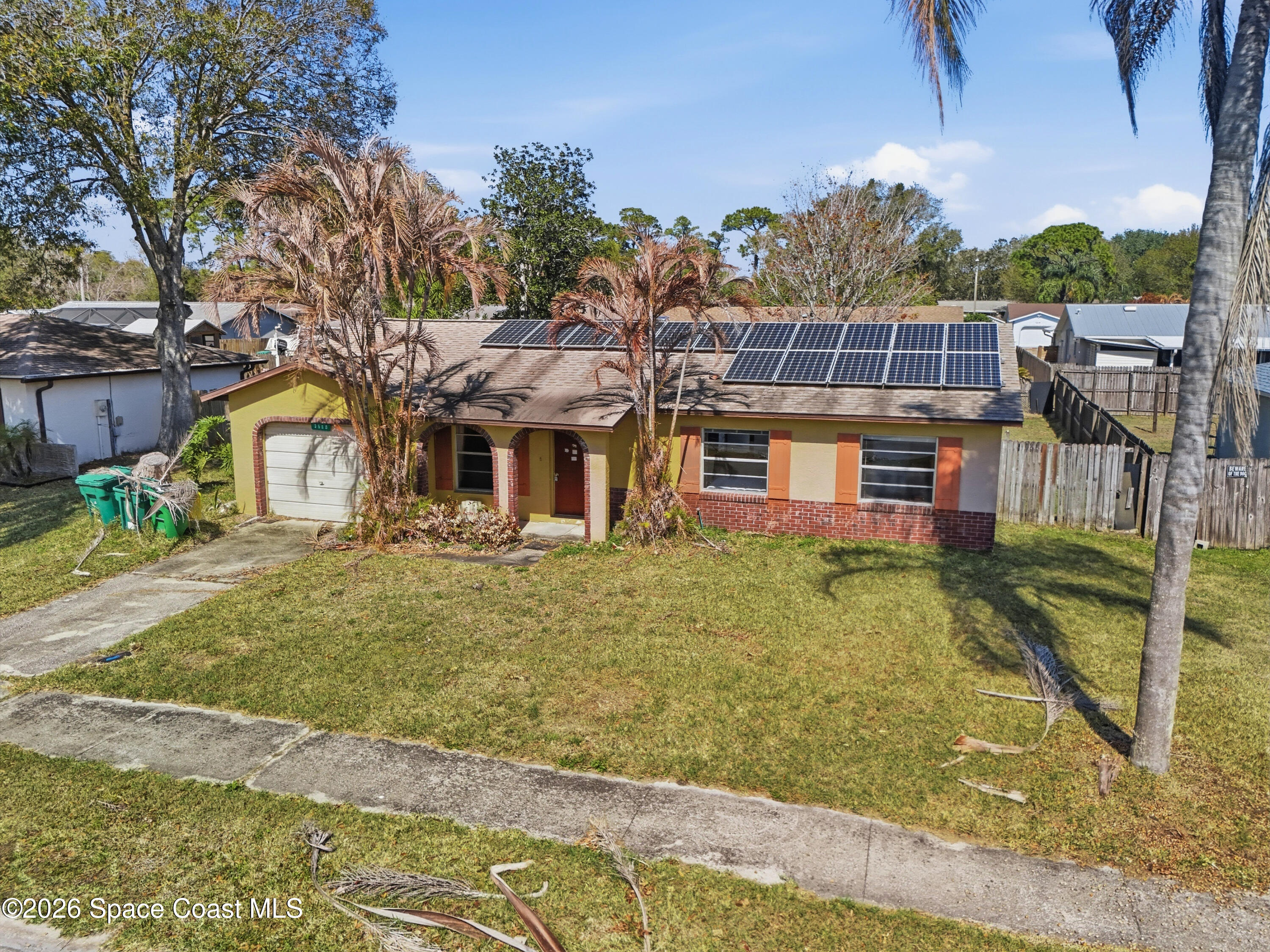 3660 Longbow Road Cocoa, FL 32926 - Photo 6 of 13 a view of a house with a yard