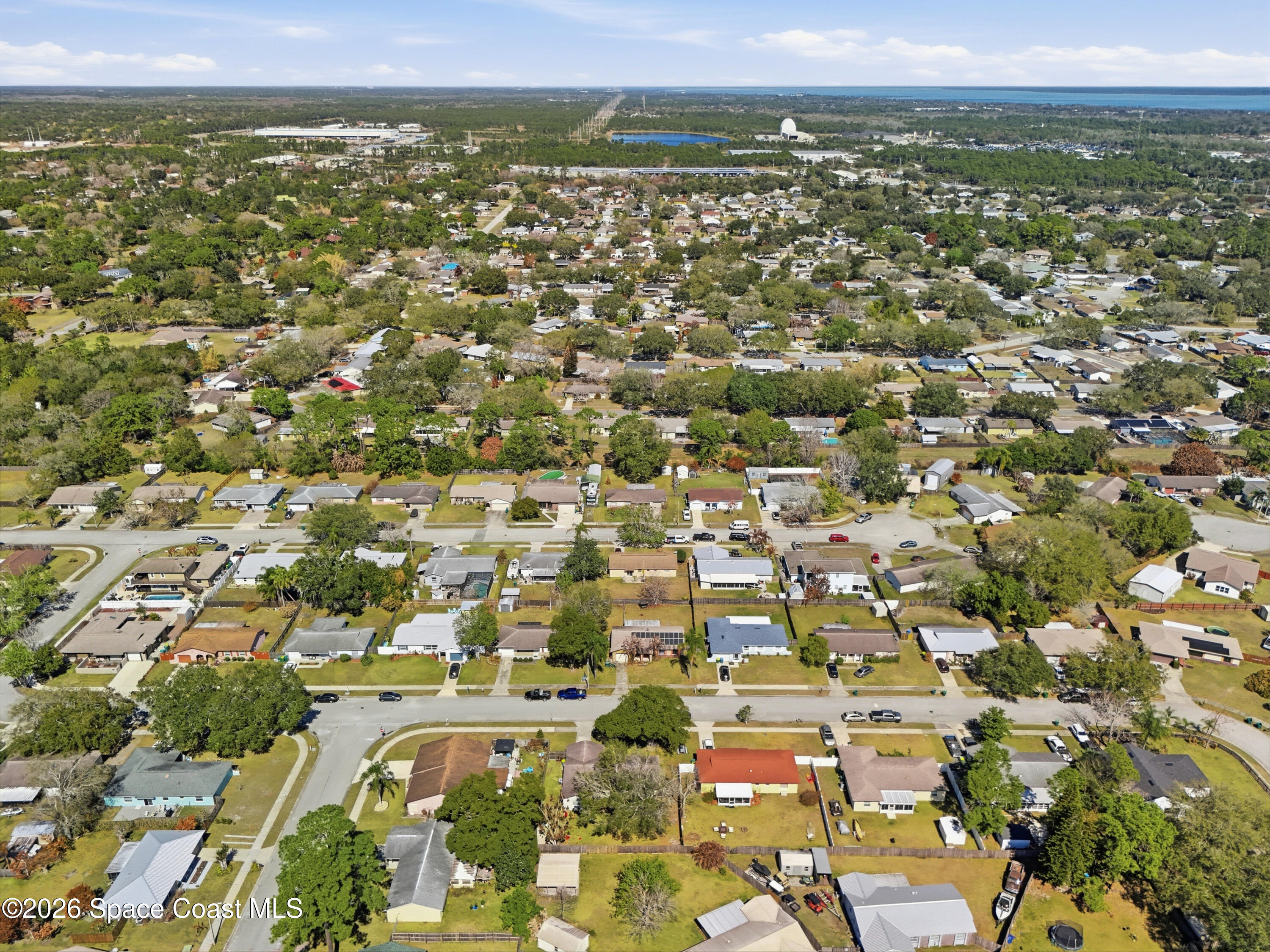3660 Longbow Road Cocoa, FL 32926 - Photo 9 of 13 an aerial view of residential houses with outdoor space