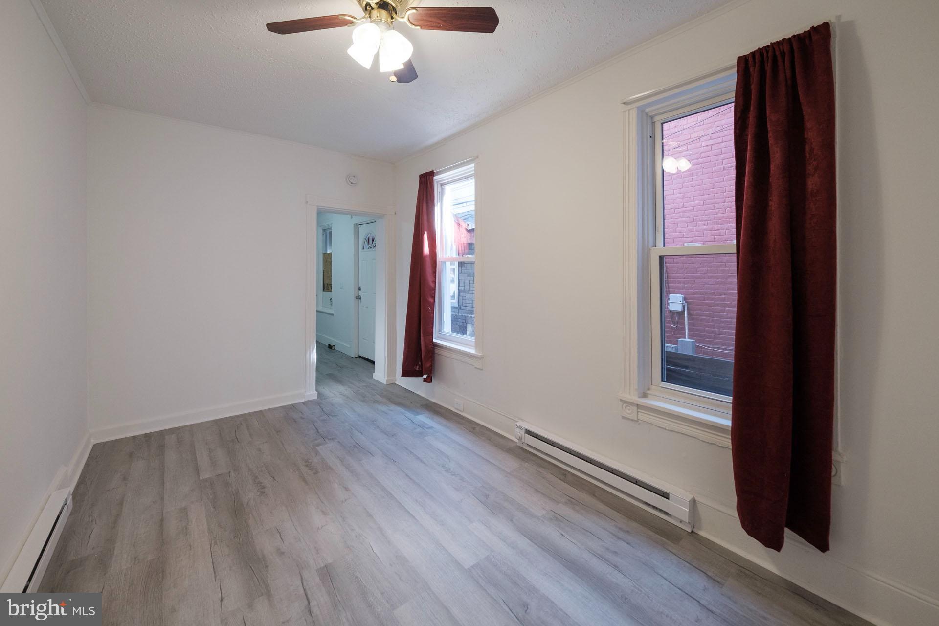 525 South 18th Street Reading, PA 19606 - Photo 11 of 18 wooden floor in an empty room with a window