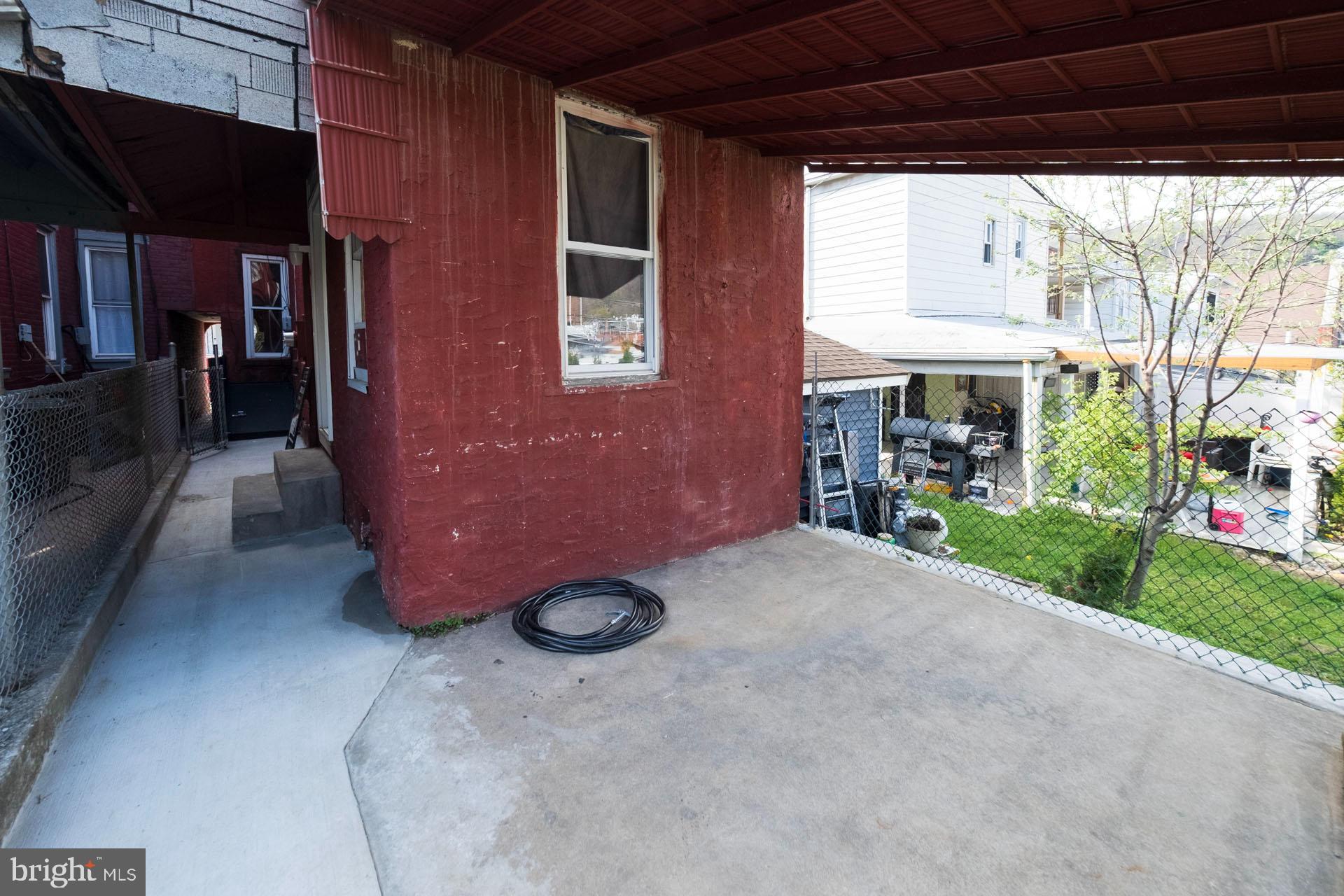525 South 18th Street Reading, PA 19606 - Photo 18 of 18 a view of a porch with furniture and a yard