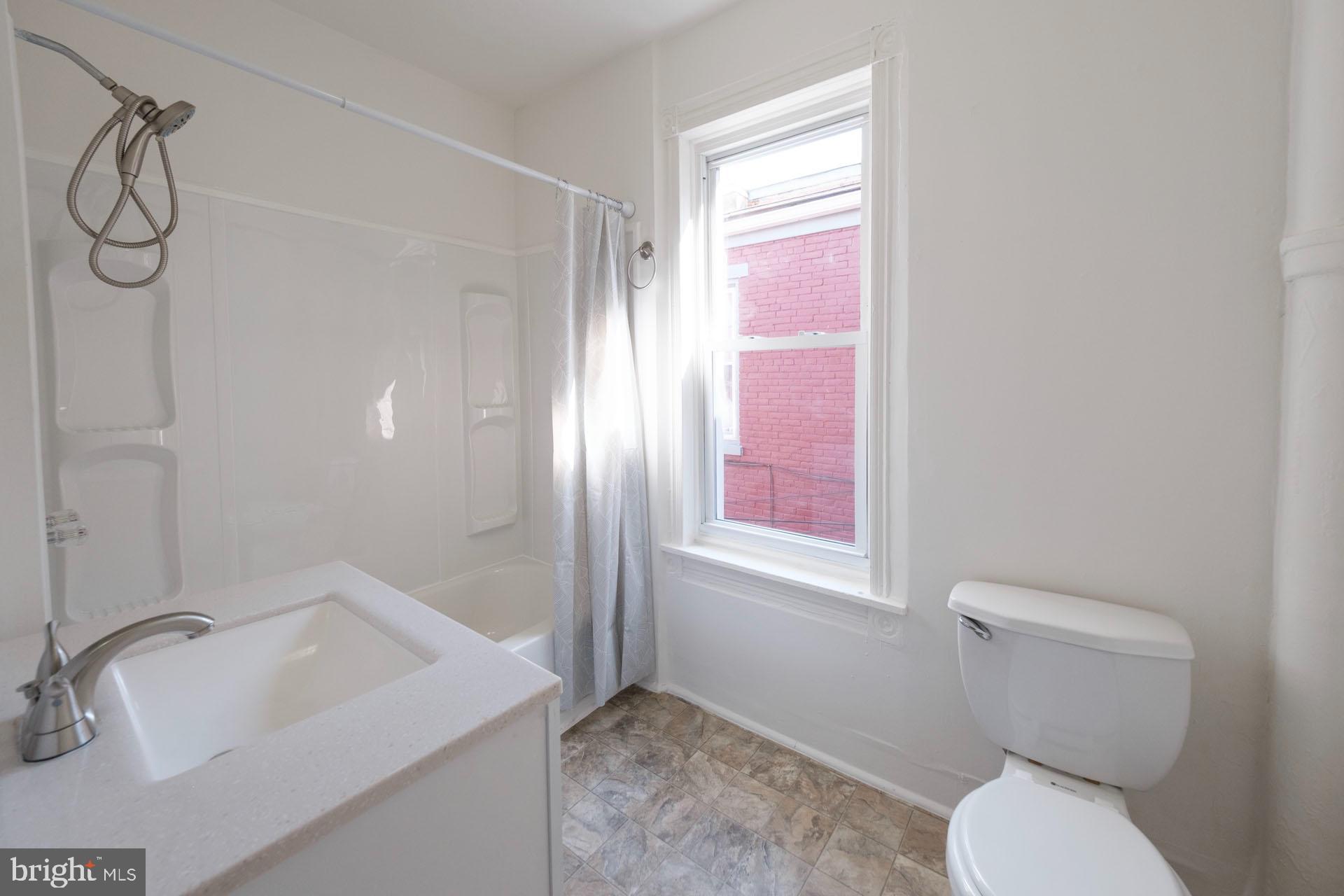 525 South 18th Street Reading, PA 19606 - Photo 8 of 18 a bathroom with a sink toilet and shower