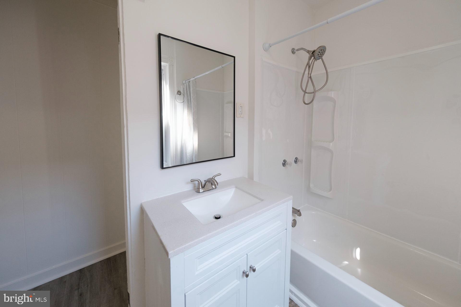 525 South 18th Street Reading, PA 19606 - Photo 9 of 18 a bathroom with a sink and a mirror