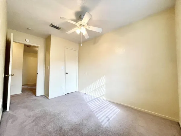 an empty room with a bathroom