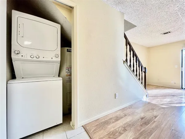 a view of storage and utility room with washer and dryer