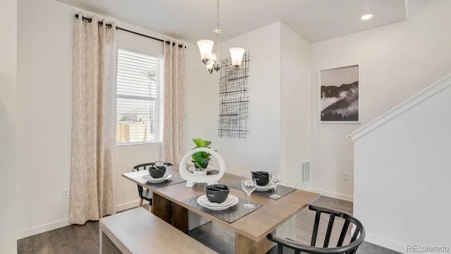 a view of a dining room with furniture and window