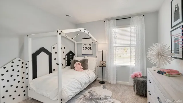 a bedroom with bed and window
