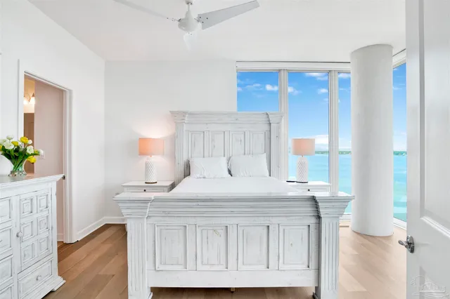 a bedroom with a bed and a table