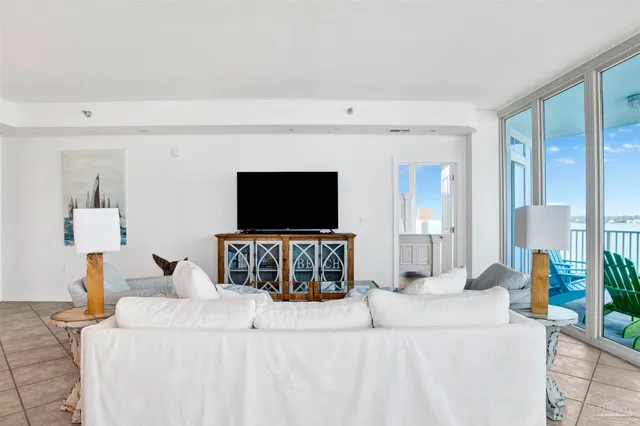 a living room with a flat screen tv and a fireplace