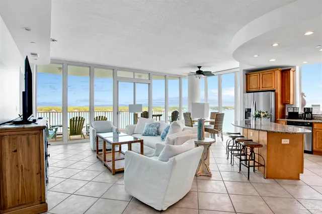 a living room with fireplace furniture and a flat screen tv