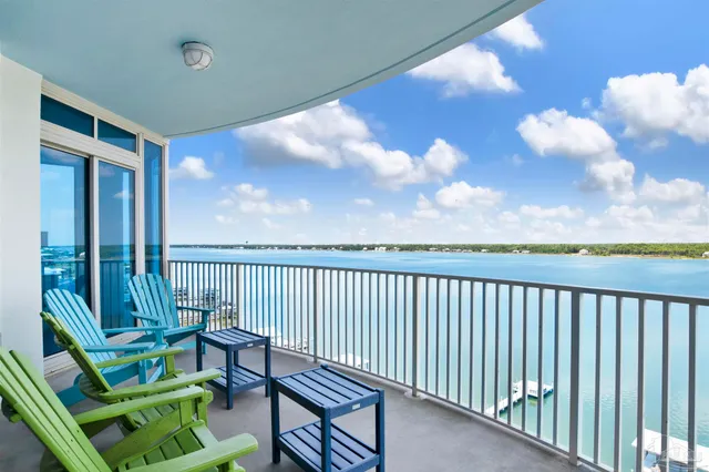 a view of a balcony with wooden floor