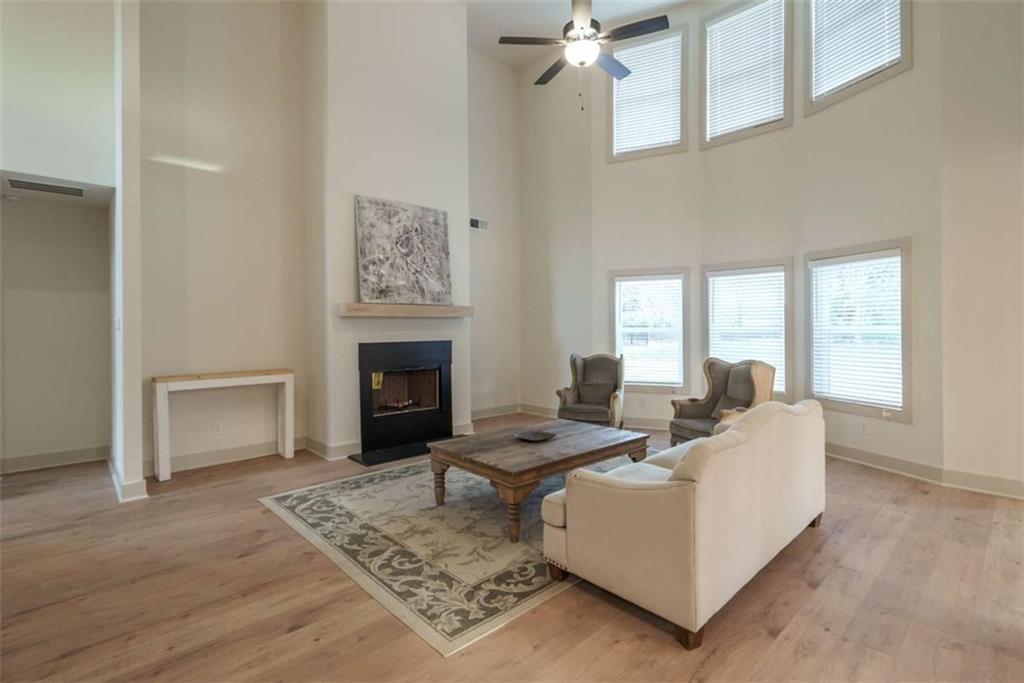 240 Good Hope Preserve Good Hope, GA 30641 - Photo 15 of 50 a living room with furniture a fireplace and a table