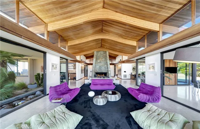 a living room with furniture and flat screen tv