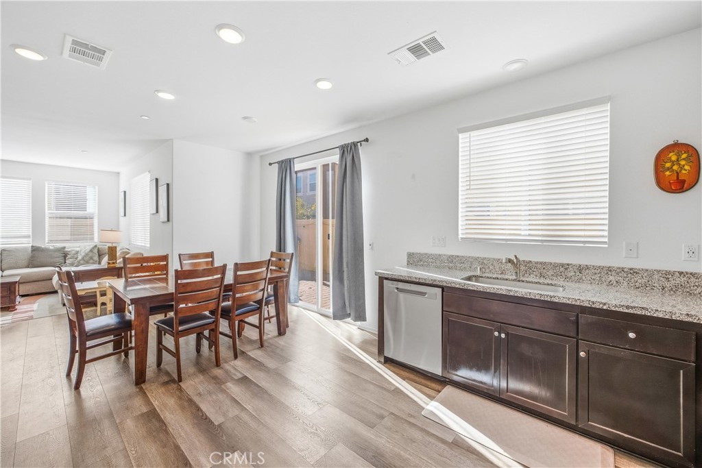925 Bluebell Way Beaumont, CA 92223 - Photo 15 of 33 a view of a a dining room with furniture window and wooden floor
