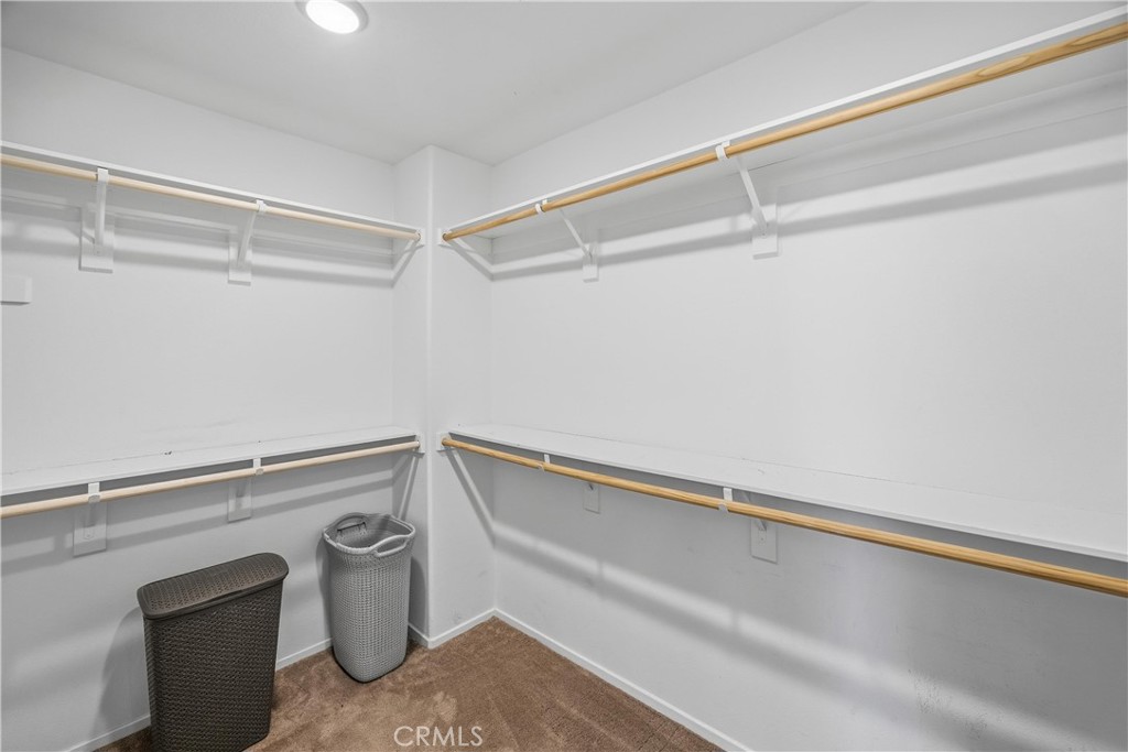 925 Bluebell Way Beaumont, CA 92223 - Photo 19 of 33 a view of a storage and utility room with racks on the wall