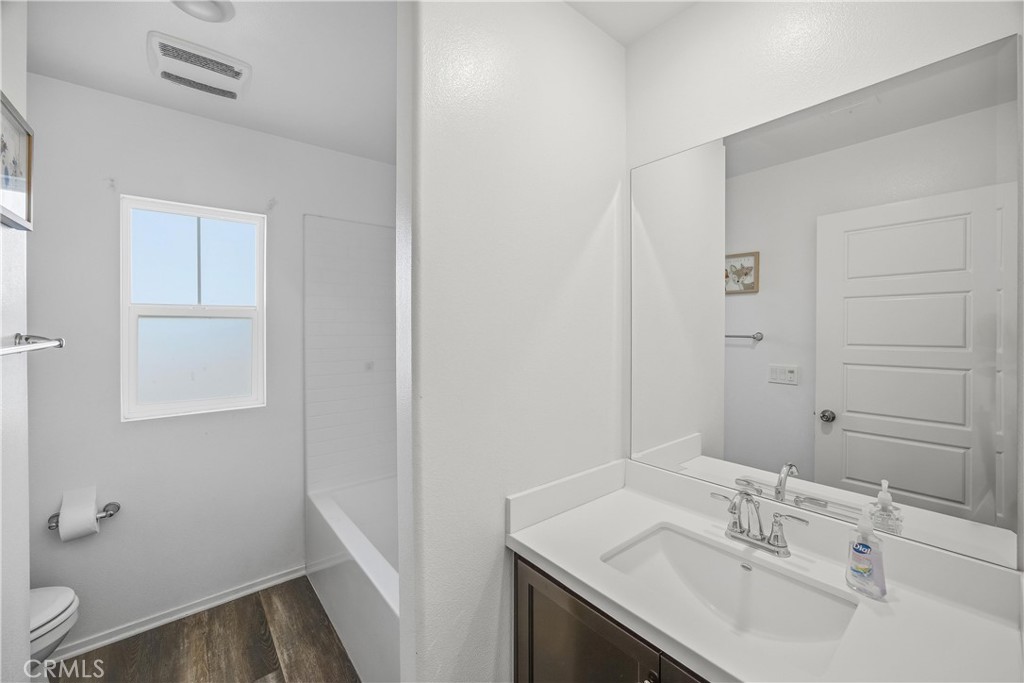 925 Bluebell Way Beaumont, CA 92223 - Photo 22 of 33 a bathroom with a sink and a mirror