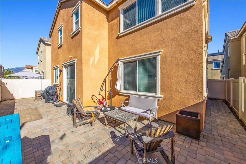 925 Bluebell Way Beaumont, CA 92223 - Photo 29 of 33 a backyard of a house with table and chairs