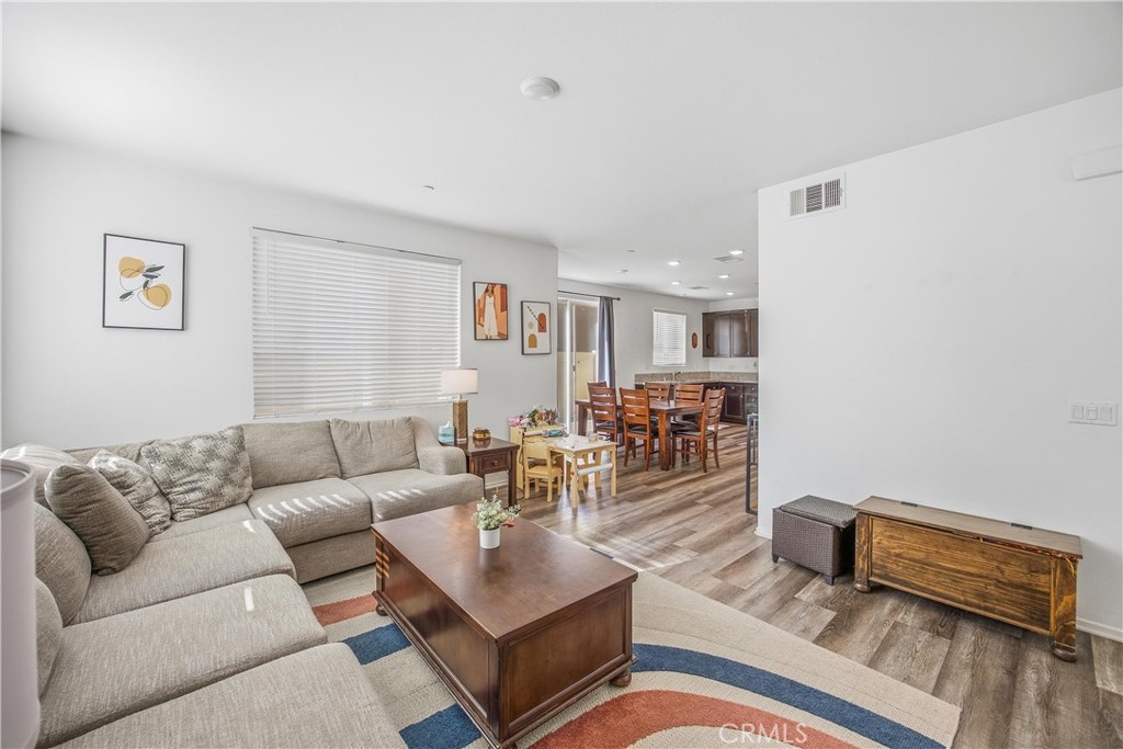 925 Bluebell Way Beaumont, CA 92223 - Photo 8 of 33 a living room with furniture and wooden floor
