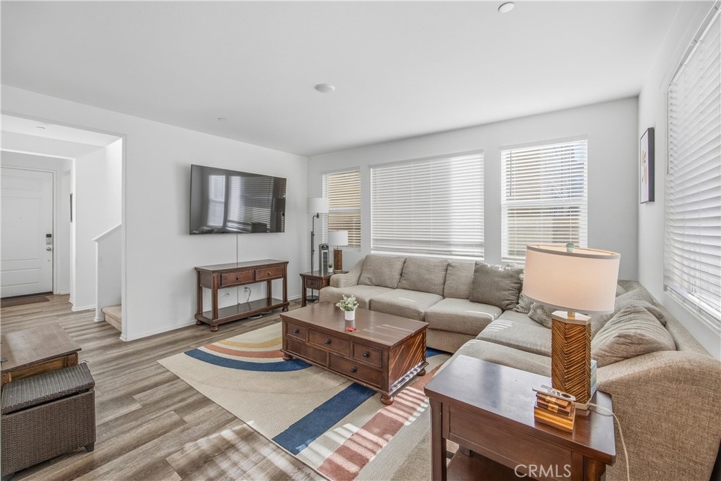 925 Bluebell Way Beaumont, CA 92223 - Photo 9 of 33 a living room with furniture and a flat screen tv