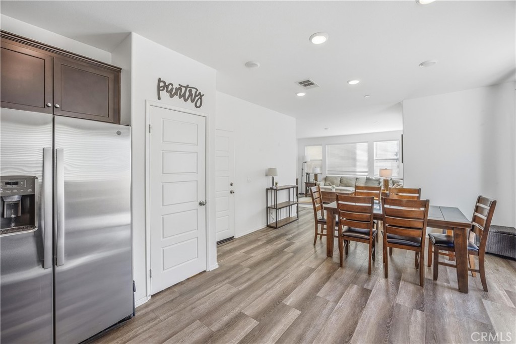 925 Bluebell Way Beaumont, CA 92223 - Photo 10 of 33 a dining room with furniture and wooden floor
