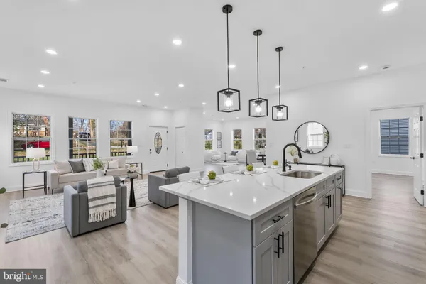 a large white kitchen with a large window