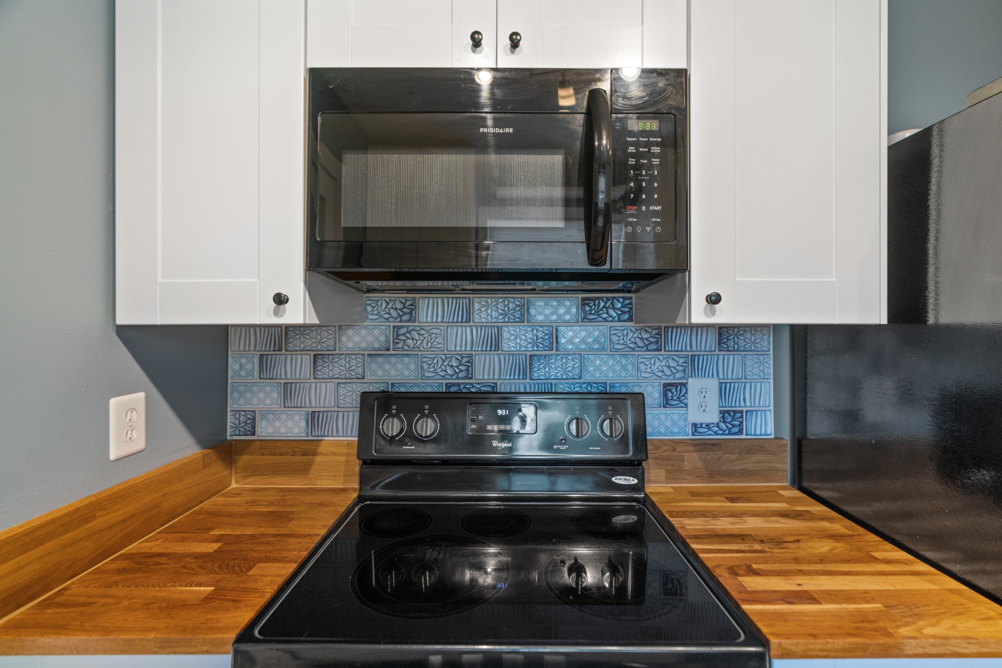 1327 Hugh Hunter Road Oak Grove, KY 42262 - Photo 21 of 36 a kitchen with a stove and a microwave