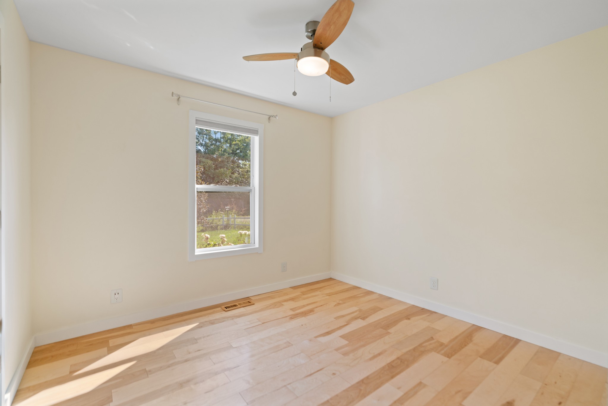 1327 Hugh Hunter Road Oak Grove, KY 42262 - Photo 25 of 36 an empty room with a window and a ceiling fan