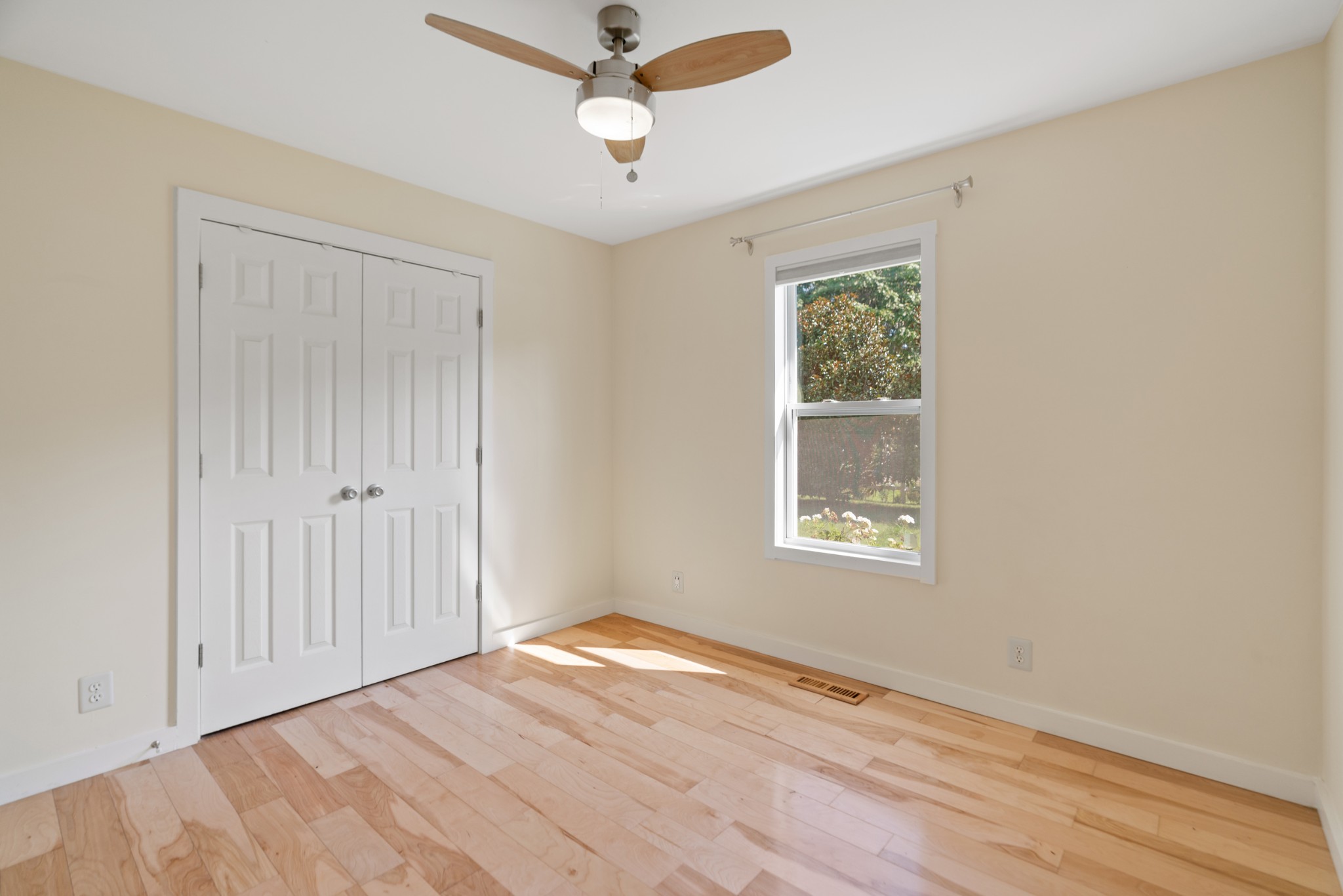 1327 Hugh Hunter Road Oak Grove, KY 42262 - Photo 26 of 36 a view of an empty room with wooden floor and a window