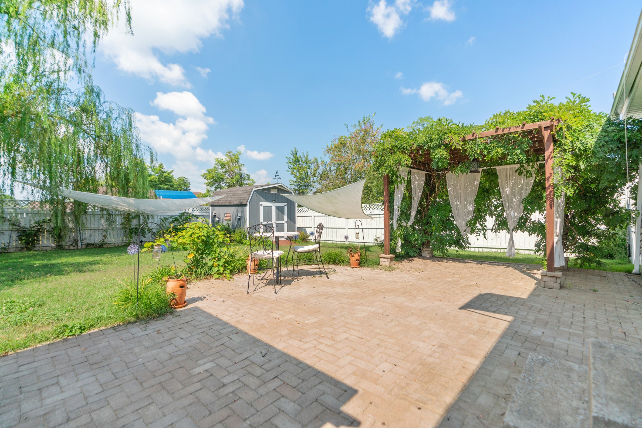 1327 Hugh Hunter Road Oak Grove, KY 42262 - Photo 33 of 36 a view of a backyard with a garden and plants