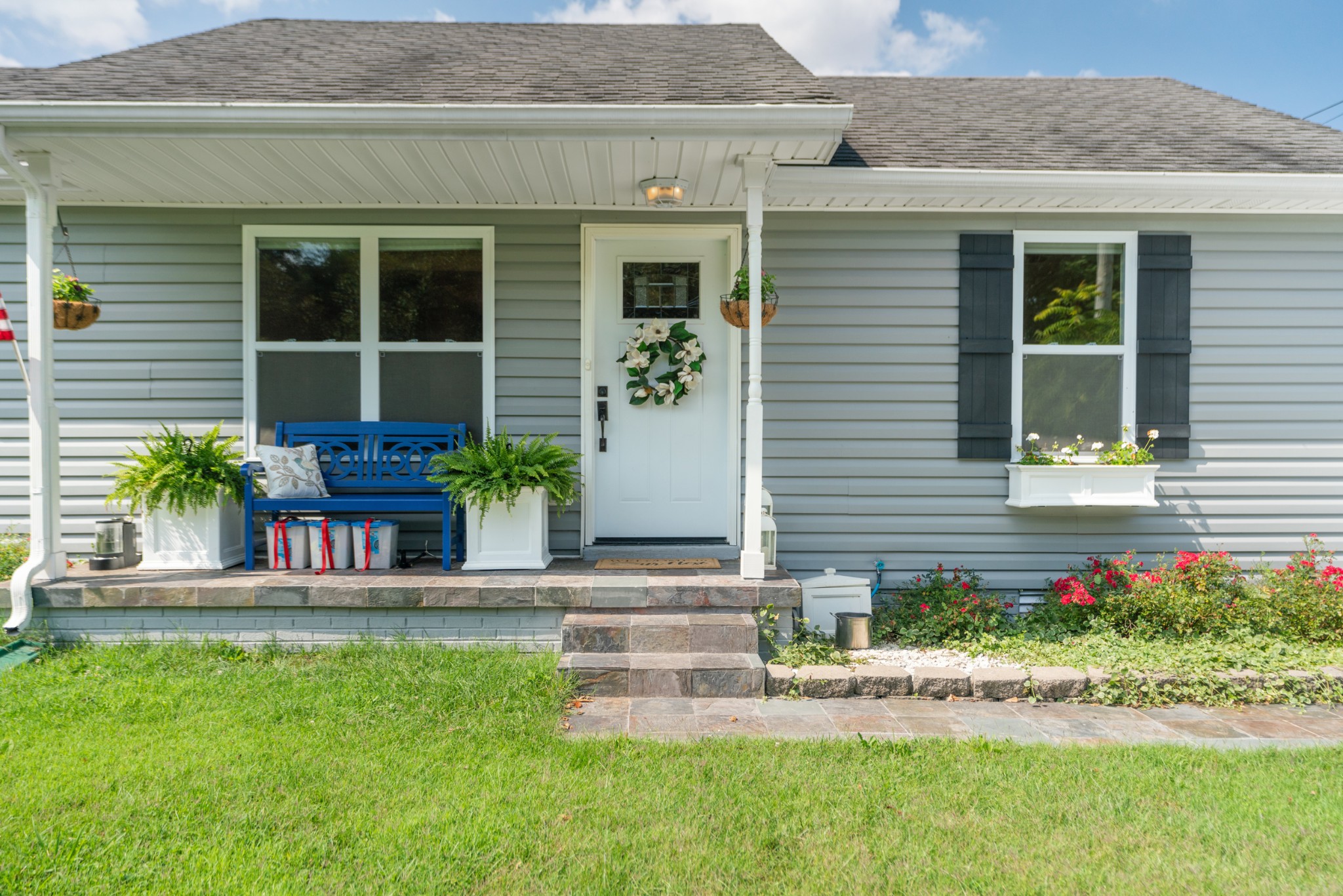 1327 Hugh Hunter Road Oak Grove, KY 42262 - Photo 6 of 36 a front view of a house with a garden and plants
