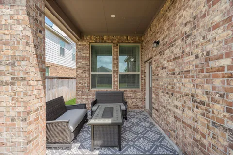 a outdoor living space with patio furniture and a fireplace