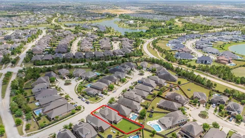 an aerial view of residential building and parking space