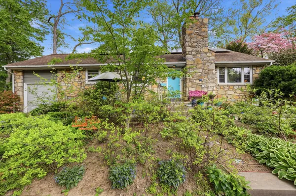 a view of a house with a tree