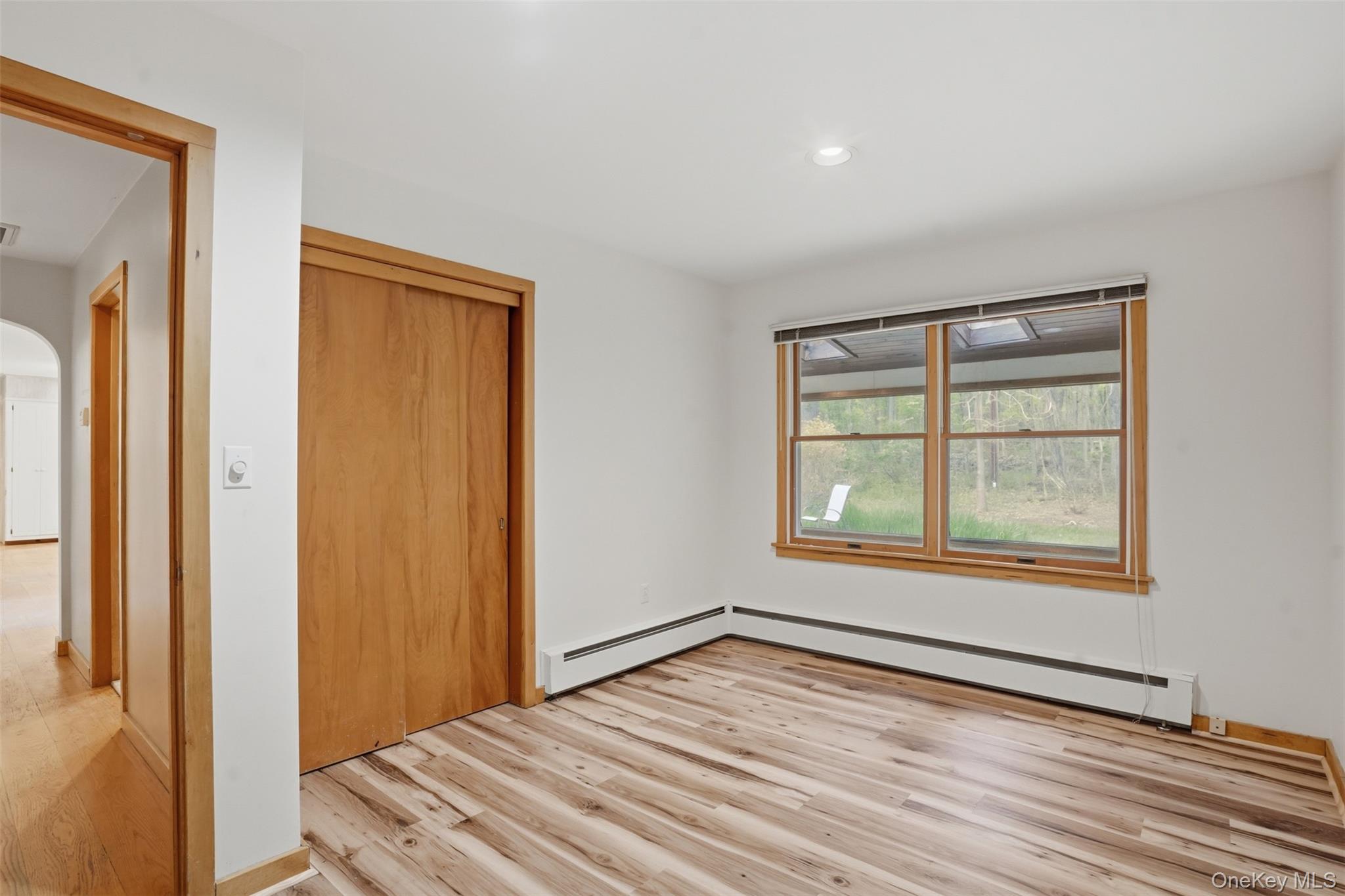 435 Samsonville Road Kerhonkson, NY 12446 - Photo 17 of 37 a view of an empty room with wooden floor and a window