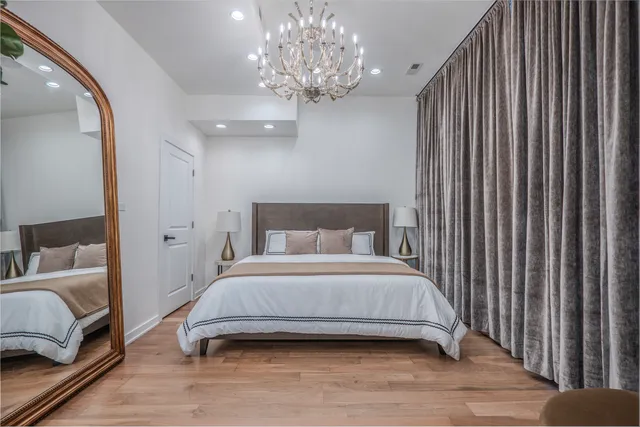 a bedroom with a bed and a couch