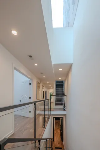 a view of a hallway with seating area