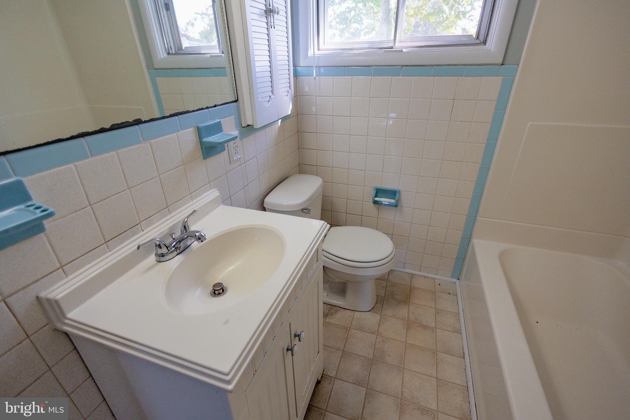 200 Baldwin Road Glassboro, NJ 08028 - Photo 12 of 29 a bathroom with a sink a toilet and a mirror