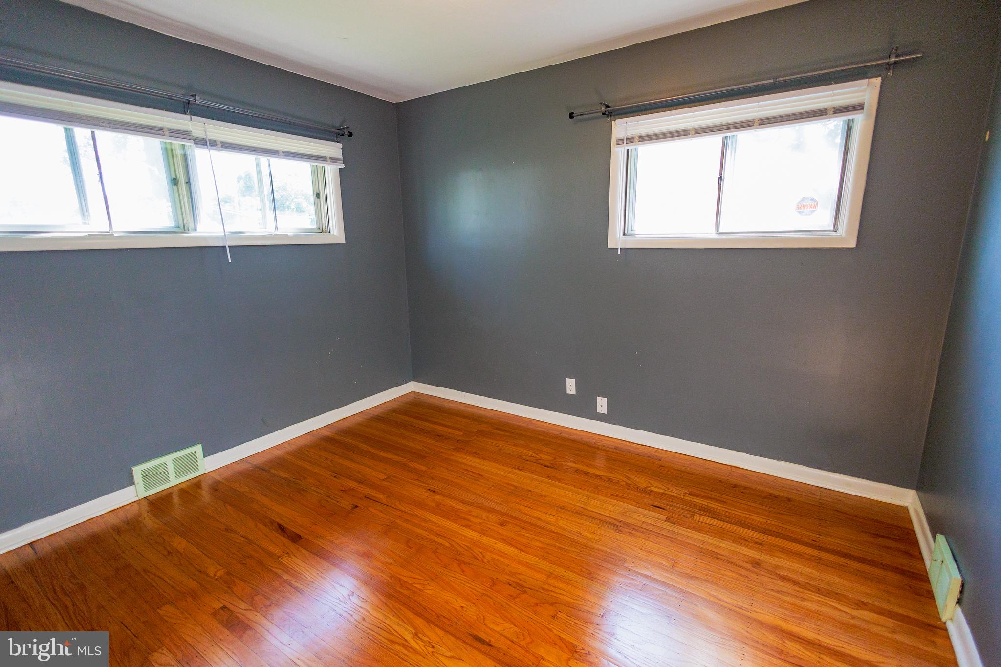 200 Baldwin Road Glassboro, NJ 08028 - Photo 17 of 29 a view of an empty room with wooden floor and a window