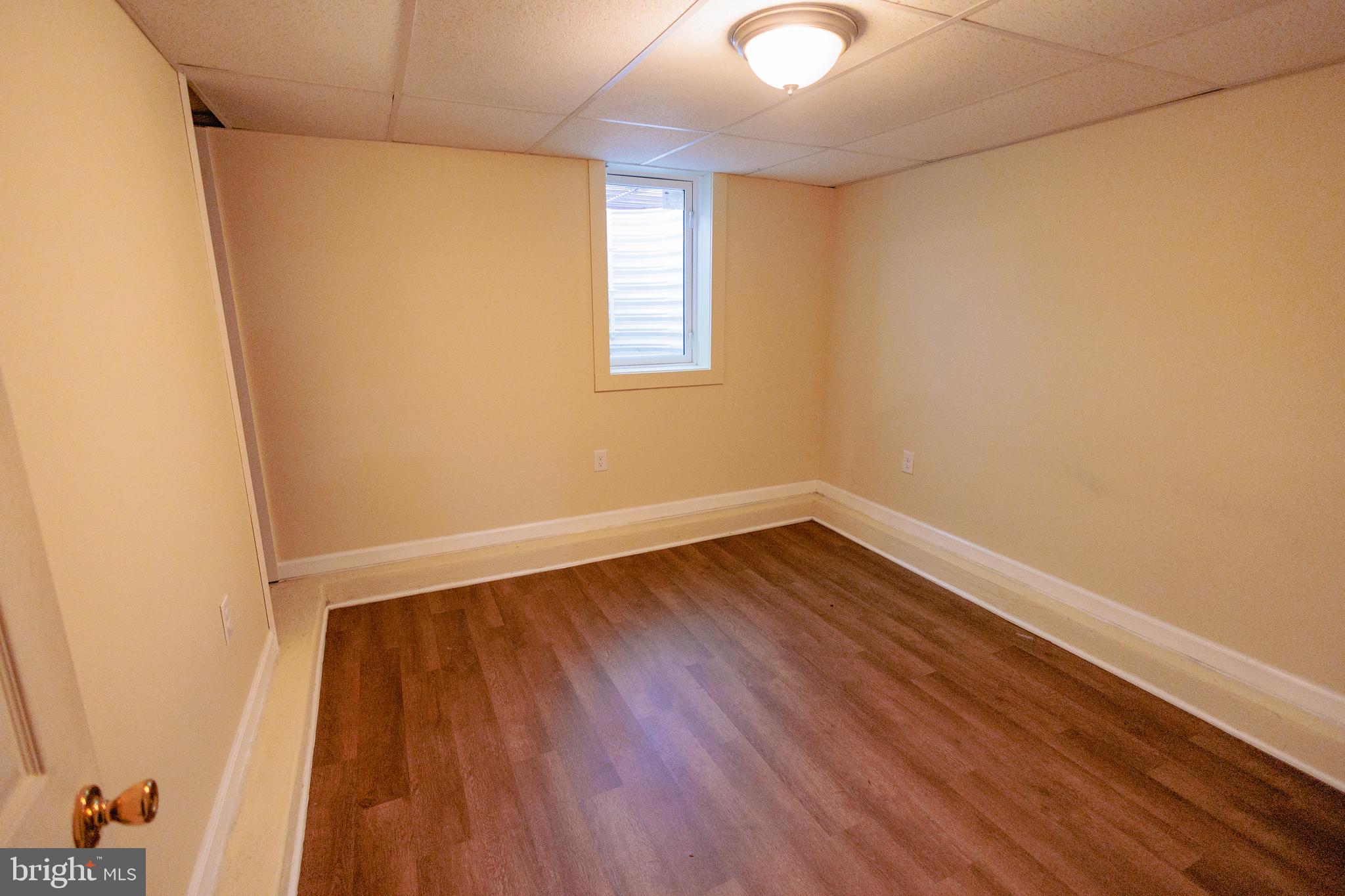 200 Baldwin Road Glassboro, NJ 08028 - Photo 24 of 29 a view of an empty room with wooden floor and a window