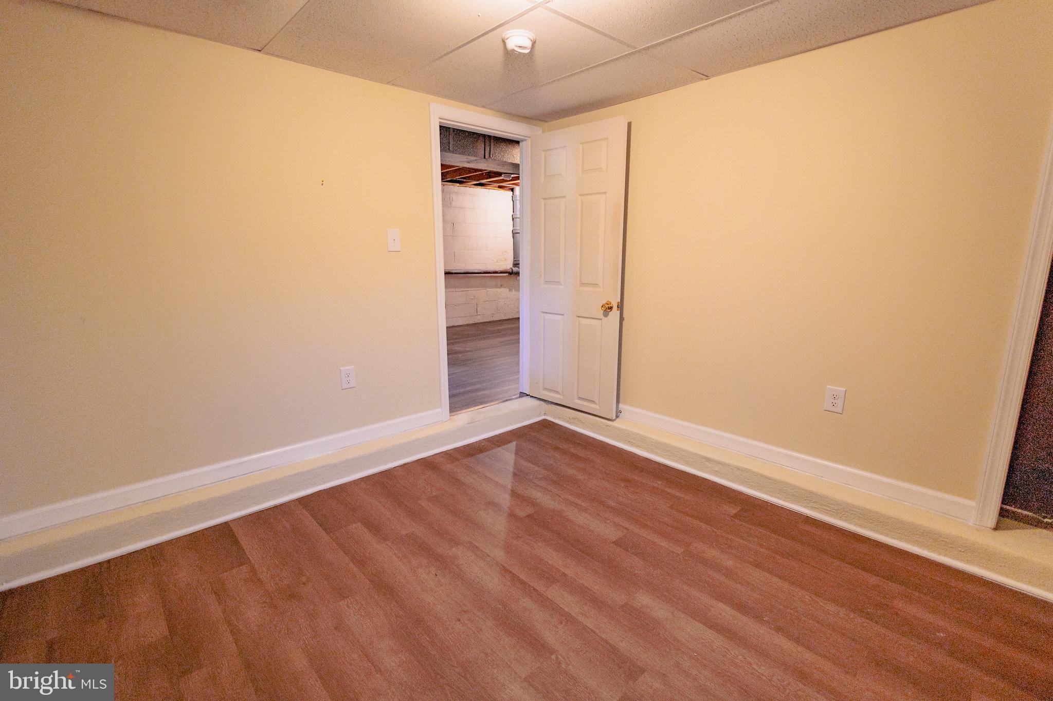200 Baldwin Road Glassboro, NJ 08028 - Photo 25 of 29 a view of an empty room with wooden floor