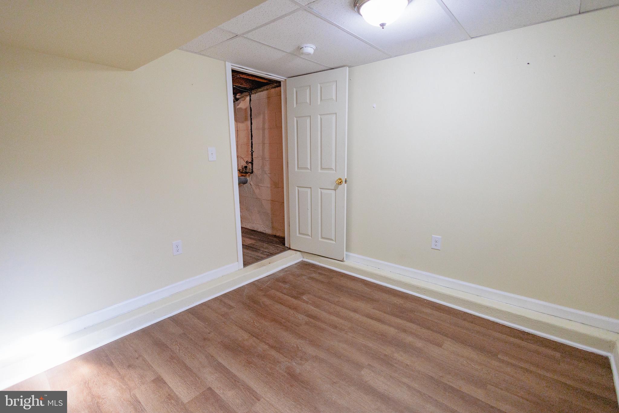 200 Baldwin Road Glassboro, NJ 08028 - Photo 27 of 29 a view of an empty room with wooden floor
