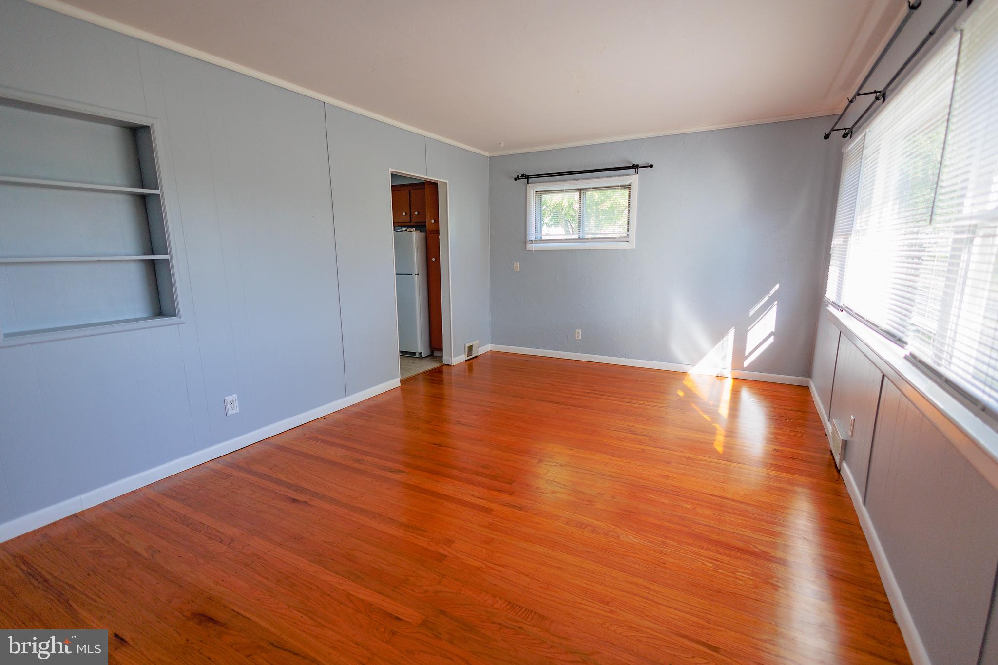 200 Baldwin Road Glassboro, NJ 08028 - Photo 6 of 29 a view of empty room with wooden floor and fan